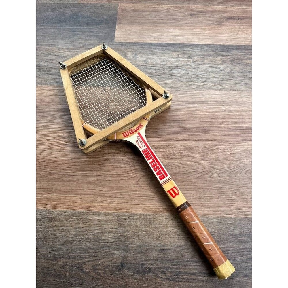 VINTAGE WILSON "JIMMY CONNORS BASELINE" TENNIS RACQUET. ANTIQUE + HOLDER